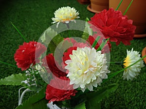 Beautiful red and cream colour plastic flowers