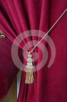Beautiful red curtain with tassel in theater photo