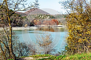 Beautiful red cypress wood in mountain lake in Sukko by Anapa, Russia. Autumn scenic landscape. Caucasus mountains. Taxodium