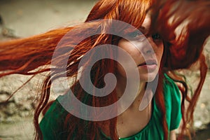 Beautiful red hair girl with deep green eyes