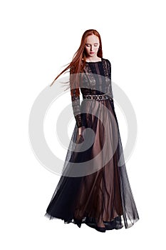 Beautiful red hair women model in long lace tulle and silk dress