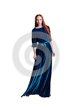 Beautiful red hair women model in long velvet blue dress