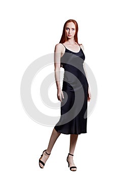 Beautiful red hair women model in silk black dress