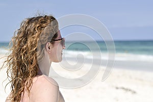 Beautiful red haired woman in bikini