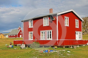 Beautiful red house in Hamningberg fishing village, northern Norway, Europe