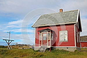 Beautiful red house in Hamningberg fishing village, northern Norway, Europe