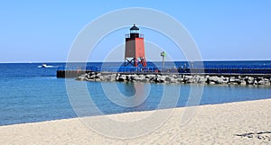 A beautiful red lighthouse on Lake Michigan.