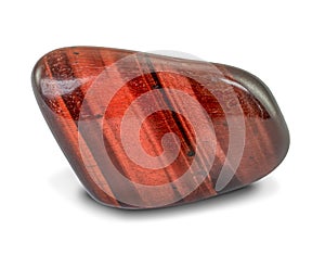 Beautiful red tiger`s eye gemstone with iridescent surface, isolated on white background. Rounded smooth surface.