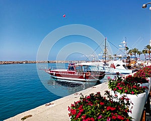 Beautiful red yacht and flowersin Side