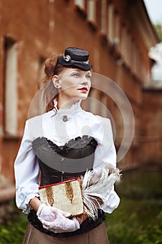 Beautiful redhair woman in vintage clothes