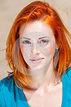 Beautiful redhead freckled blue-eyed woman