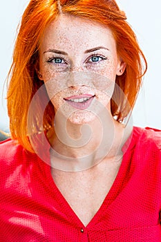 Beautiful redhead freckled woman photo