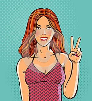 Beautiful redhead girl. Hand gesture is symbol of victory or peace. Pop art retro comic style. Cartoon vector