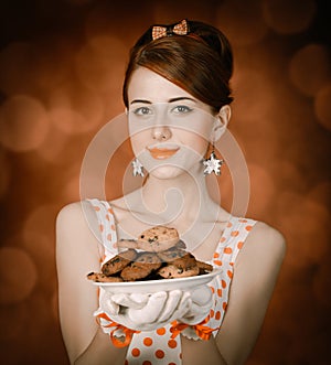 Beautiful redhead woman with coockie