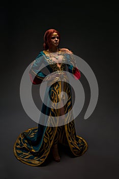 Beautiful redhead woman in cosplay costume