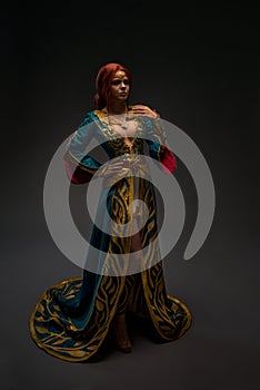 Beautiful redhead woman in cosplay costume photo