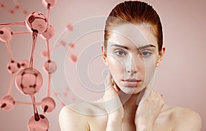 Beautiful redhead woman near pink glass molecule structure.