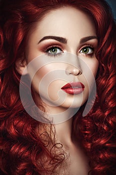 Beautiful redhead woman with wavy hair photo