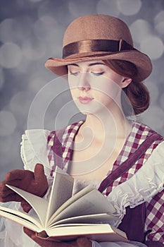 Beautiful redhead women with book.