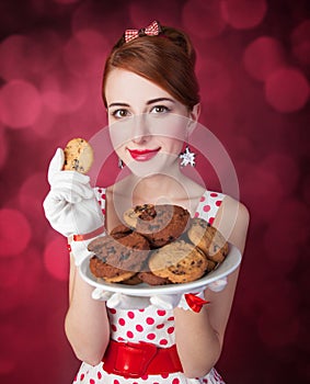 Beautiful redhead women with coockie