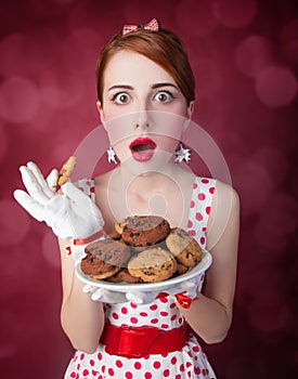 Beautiful redhead women with coockie