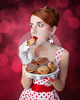 Beautiful redhead women with coockie