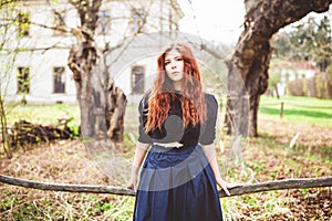 Beautiful redhead young woman outdoor portrait