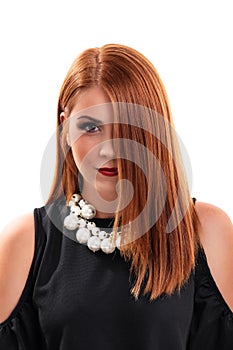 Beautiful redheaded young woman with hair covering half her face