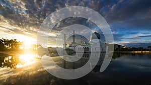 Beautiful reflection of mosque at sunrise