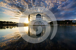 Beautiful reflection of mosque at sunrise