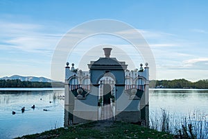 Beautiful reflections at the Banyoles lake at sunset. Calm lake water at dusE at Wstany de Banyoles. Concept of peaceful and