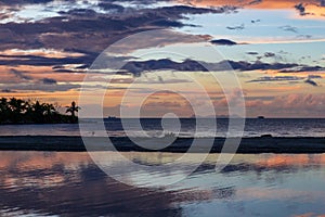 Beautiful reflections on the ocean of sunset in Fiji