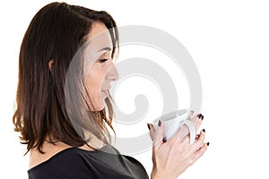 Beautiful relaxed profile young woman holding white mug