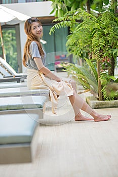 Beautiful relex on lounger near swimming pool in hotel, krabi,