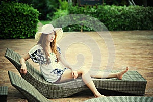 Beautiful relex on lounger near swimming pool in hotel, krabi, T