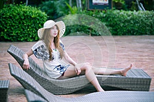 Beautiful relex on lounger near swimming pool in hotel, krabi, T