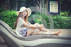 Beautiful relex on lounger near swimming pool in hotel, krabi, T