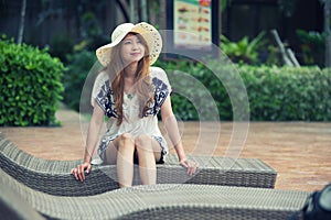 Beautiful relex on lounger near swimming pool in hotel, krabi, T