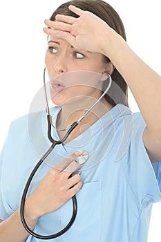 Beautiful Relieved Concerned Young Female Doctor Listening To Her Own Heartbeat Through Stethoscope