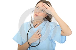 Beautiful Relieved Concerned Young Female Doctor Listening To Her Own Heartbeat Through Stethoscope photo