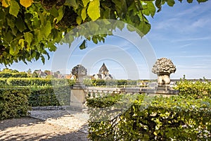 Beautiful renaissance park with historic church on the background, chateau Villandry, Loire region, France.