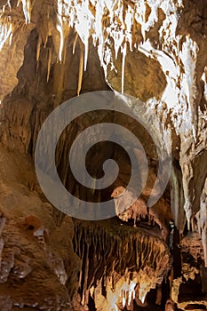 A beautiful Resava cave (Resavska pecina) in Serbia, massive columns of stalagmites and stalactites on the cave bottom.