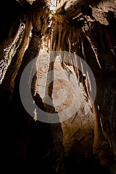 A beautiful Resava cave (Resavska pecina) in Serbia, massive columns of stalagmites and stalactites on the cave bottom.