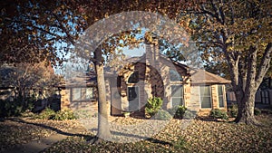 Beautiful residential house entrance with colorful fall foliage near Dallas
