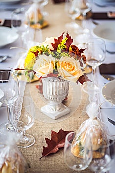 Beautiful restaurant interior table decoration for wedding or event. Flower Wedding Table Decoration/ Autumn colors.