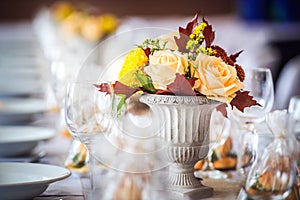 Beautiful restaurant interior table decoration for wedding or event. Flower Wedding Table Decoration/ Autumn colors.