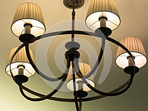 Beautiful retro luxury vintage chandelier hanging from ceiling. Classic lamp lighting