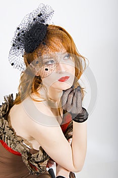 Beautiful retro woman with vintage hat and veil