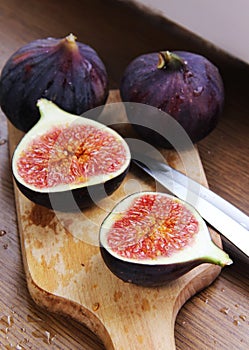 Beautiful ripe fresh pulpy figs on the table