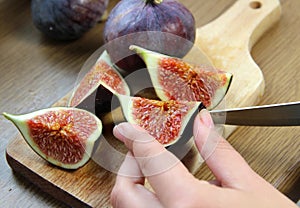 Beautiful ripe fresh pulpy figs on the table